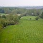 May 2016. Looking along the meadow with the brook on the left, towards the ordhard.